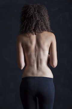 topless woman in black skirt