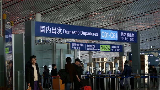 people standing in front of blue and white building during daytime