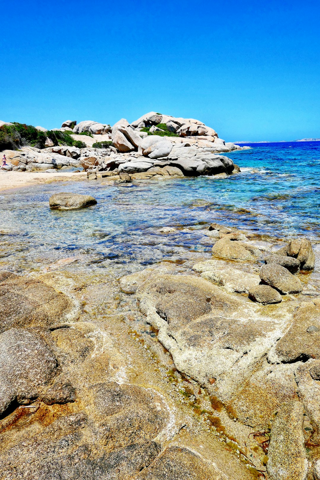 gray rocks on sea shore during daytime