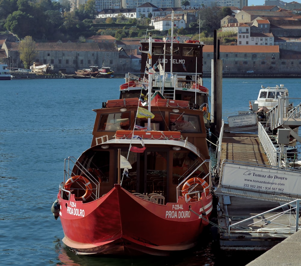 red and white ship on sea during daytime