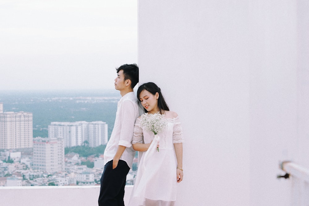 a man and a woman standing next to each other