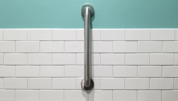Accessible Bathroom Design: stainless steel shower head on white ceramic wall tiles