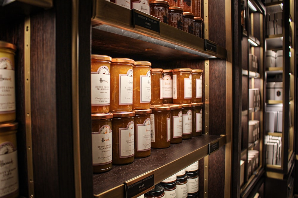 brown wooden shelf with bottles