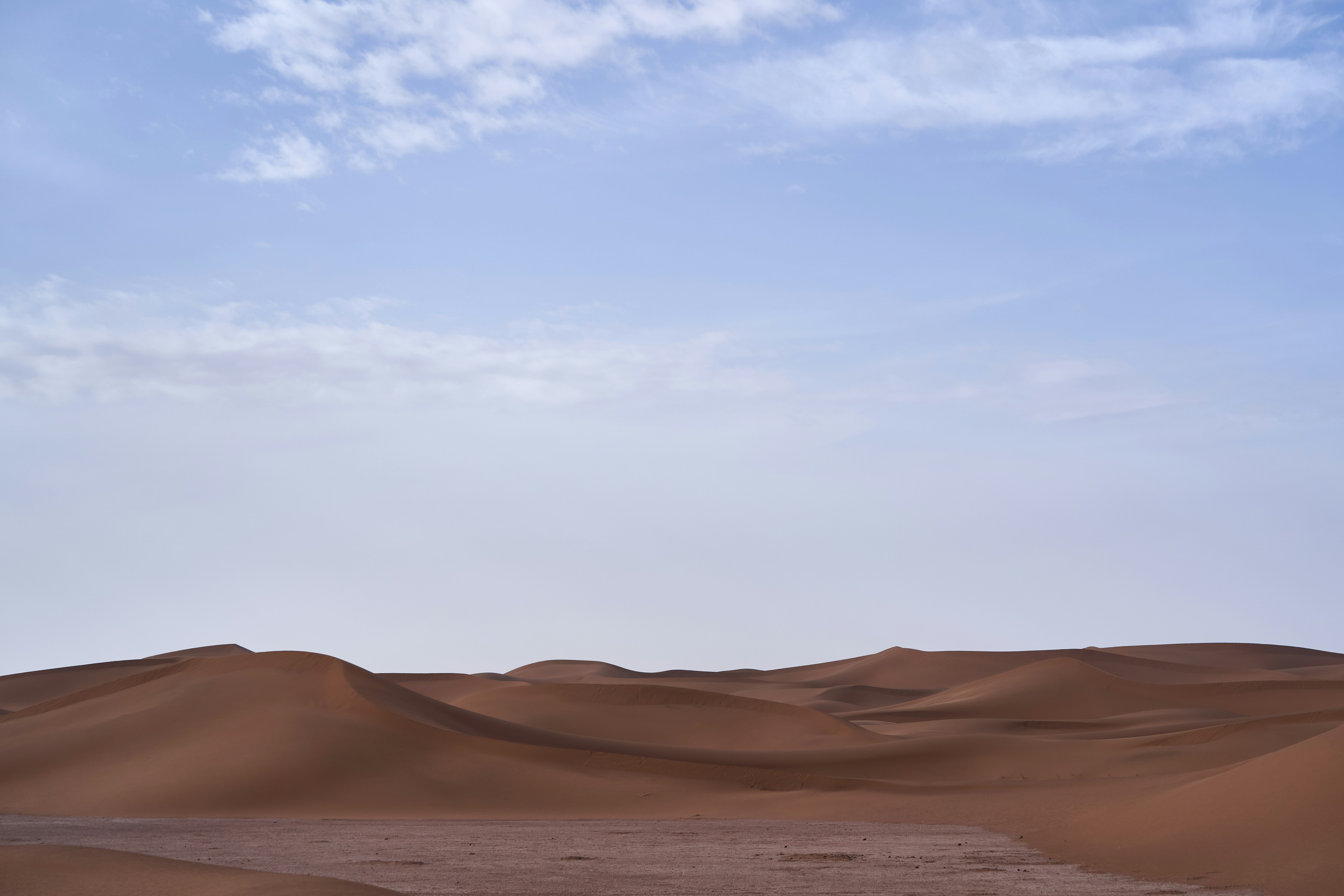 brown sand under blue sky during daytime