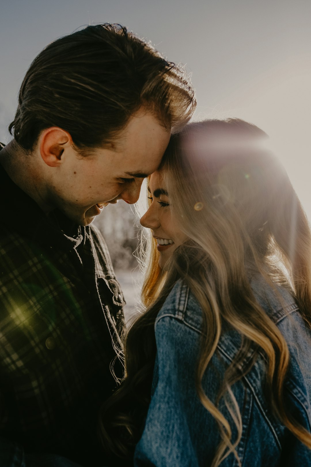 man and woman kissing during daytime