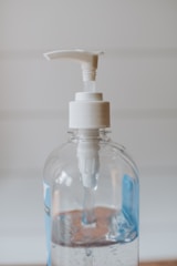 white and clear plastic pump bottle