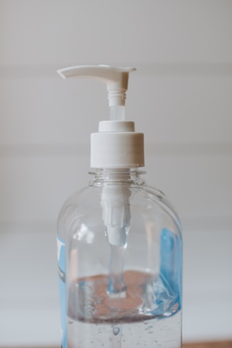 white and clear plastic pump bottle