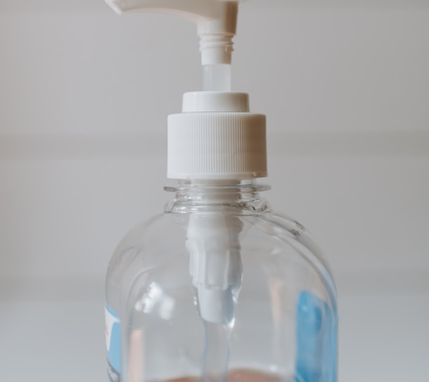 white and clear plastic pump bottle