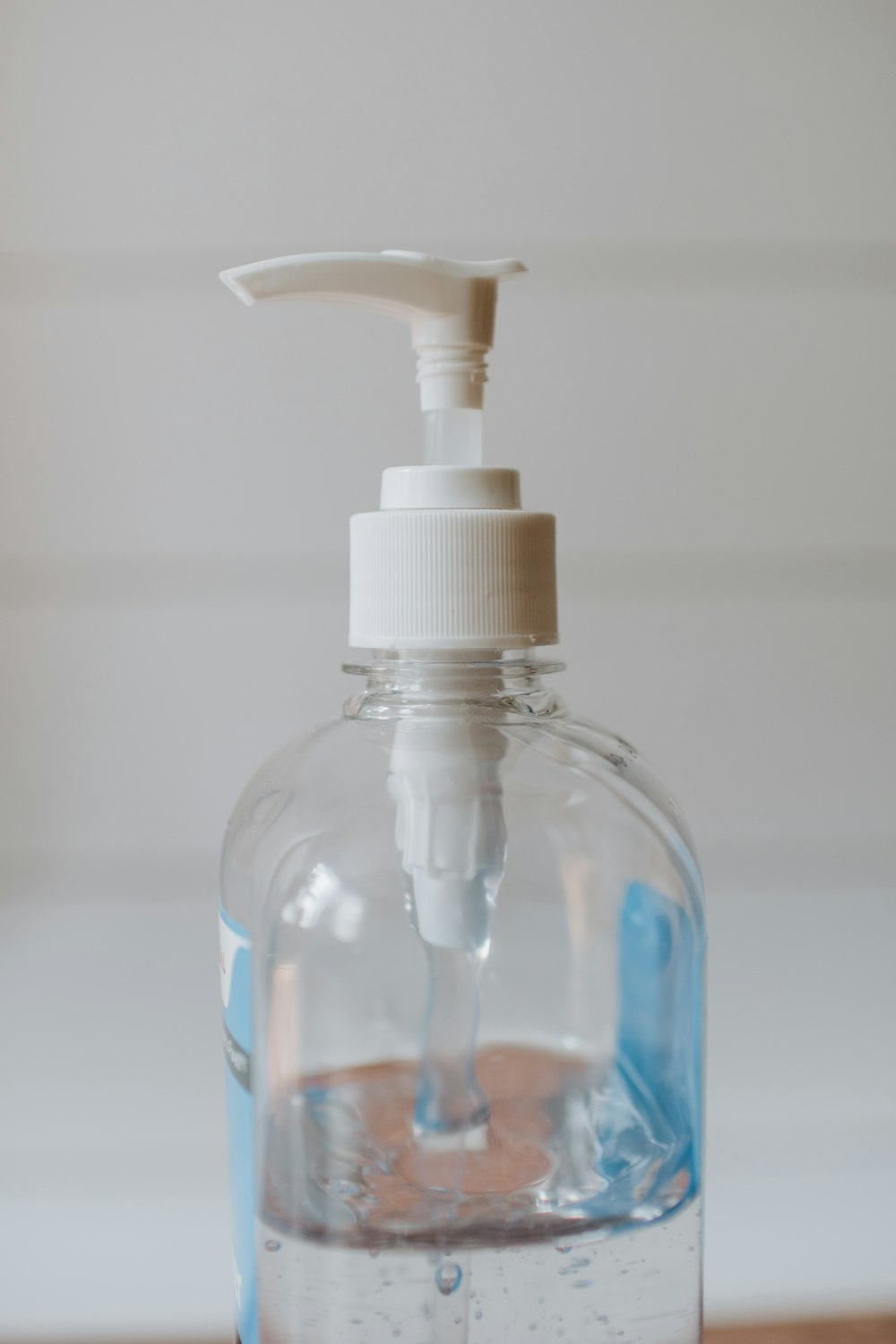 white and clear plastic pump bottle