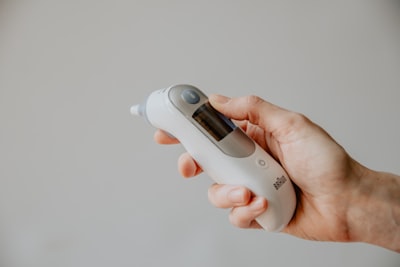 ear thermometer for checking fever coronavirus teams background
