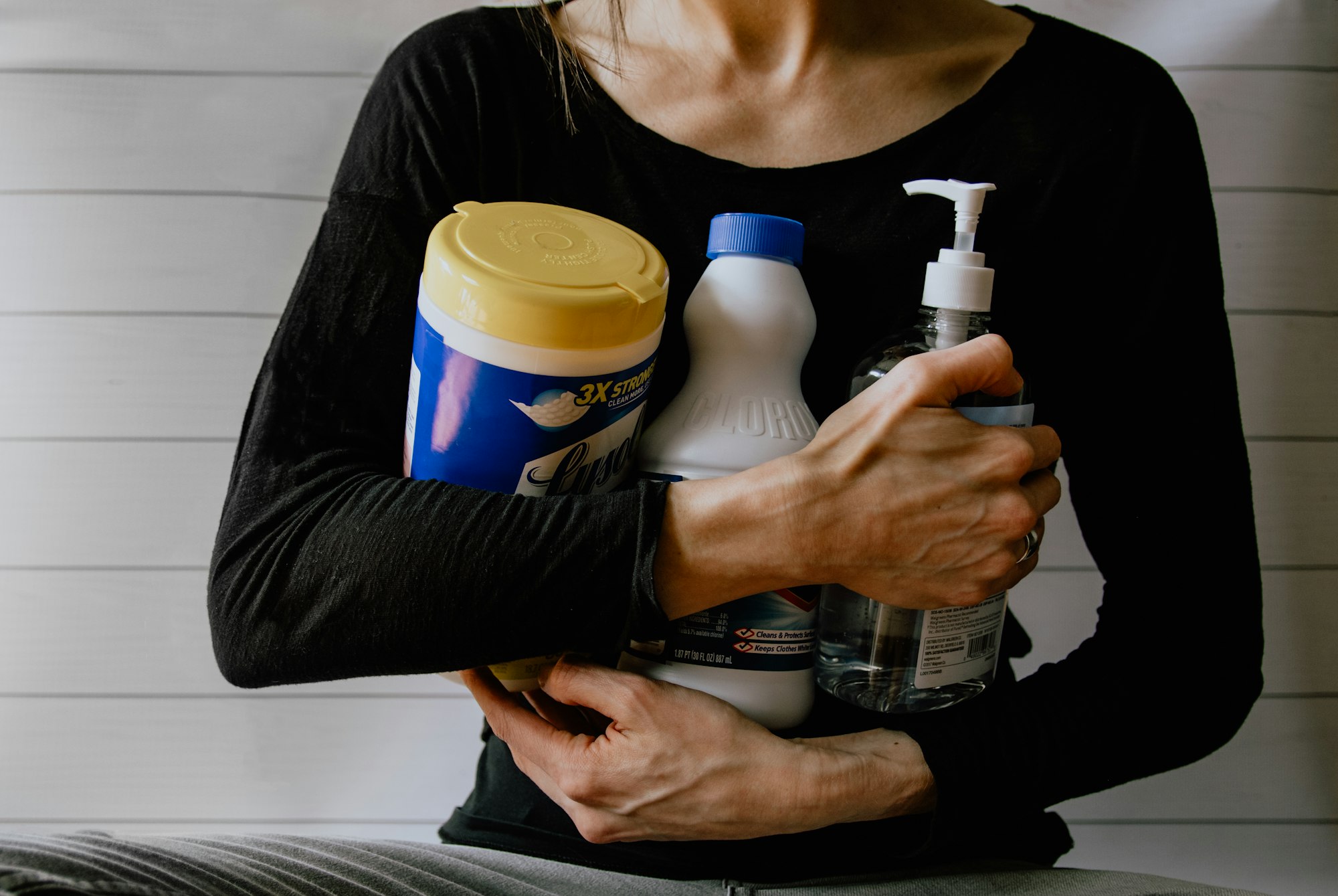 Woman gathering cleaning supplies