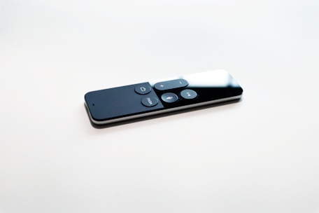 black remote control on white surface