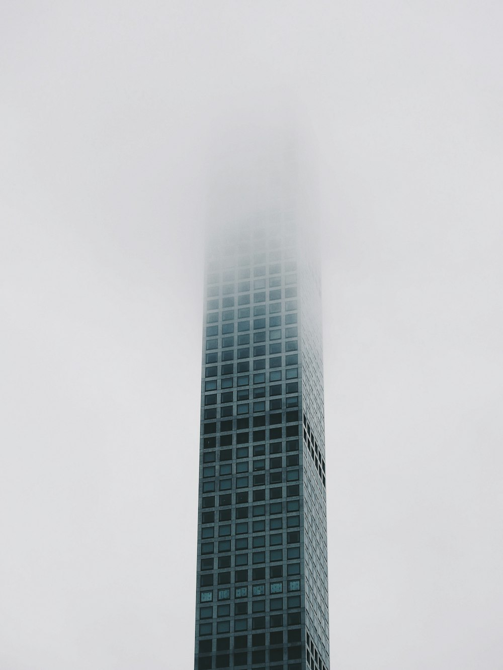 gray high rise building under white sky