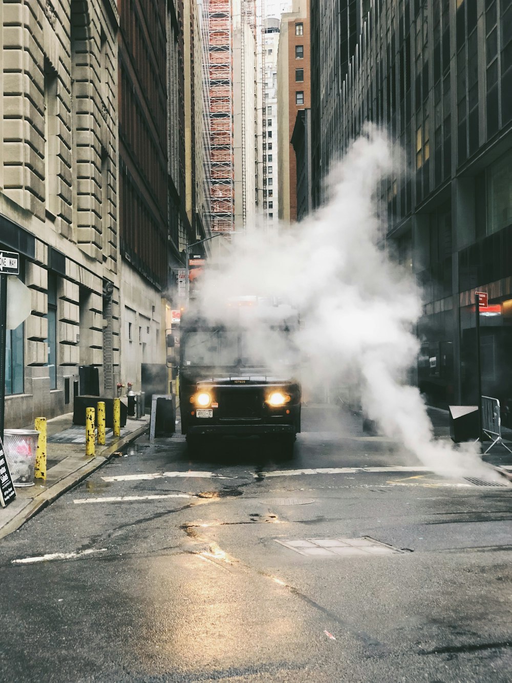 white smoke coming out from a city street