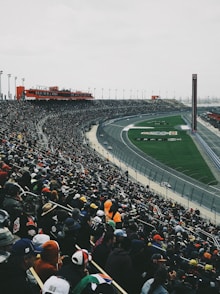 people watching football game during daytime