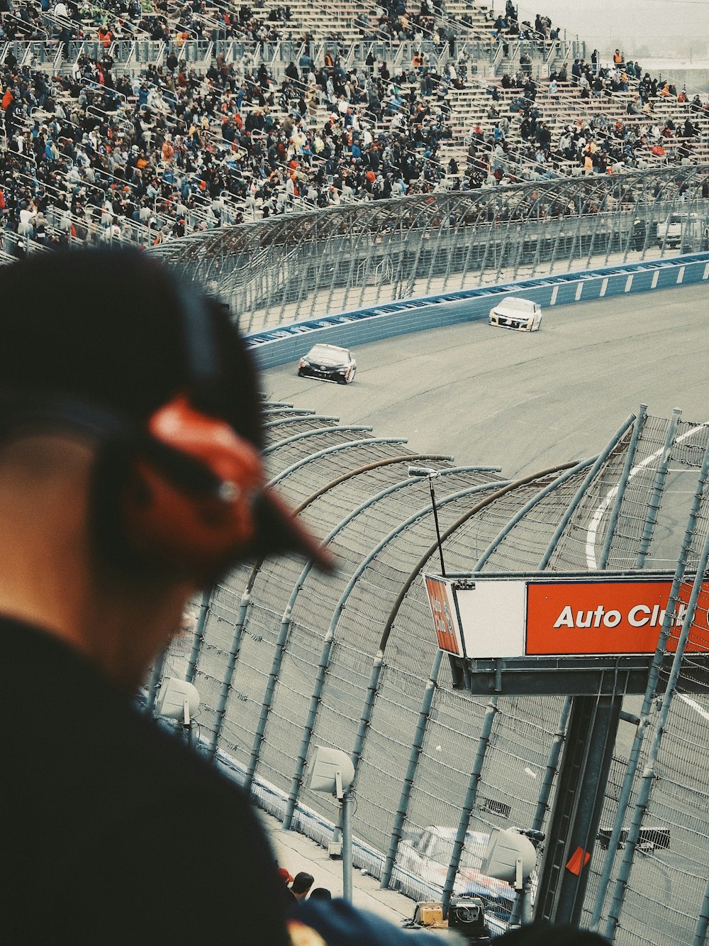 people watching racing game during daytime