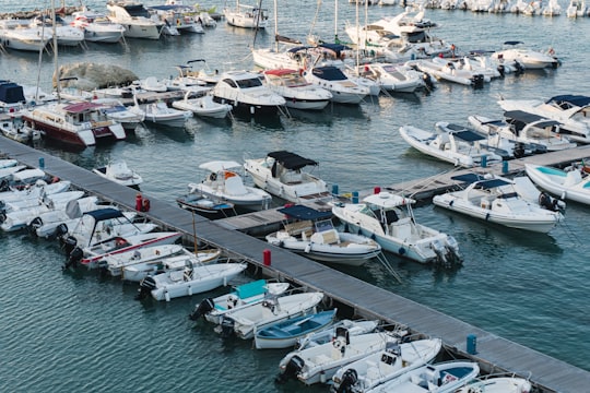 white and blue boats on body of water during daytime in Otranto Italy