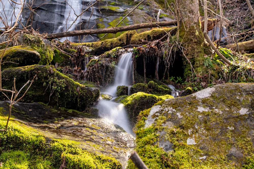 water falls on gray rock