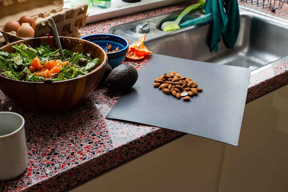 brown nuts on brown wooden chopping board