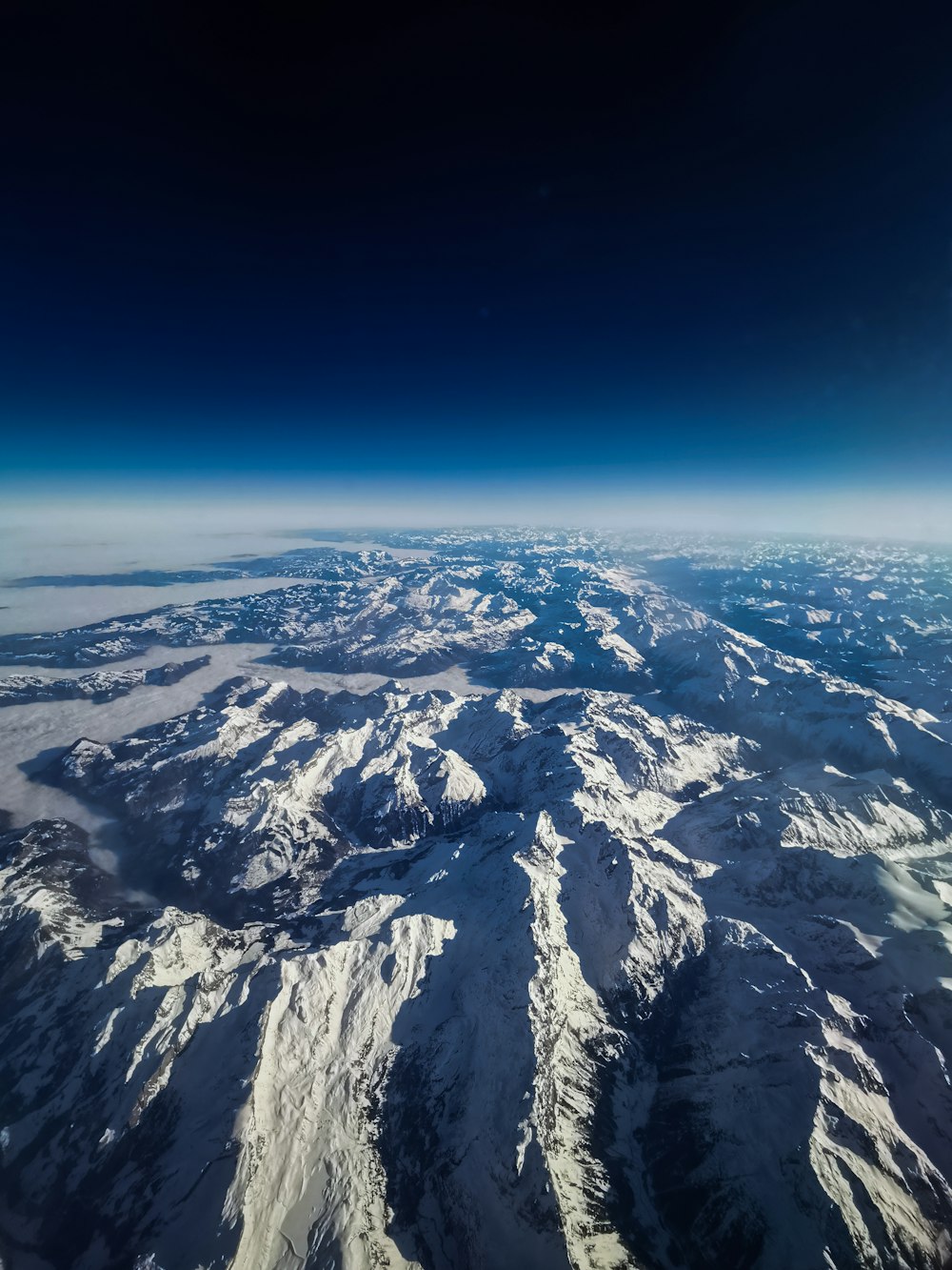 aerial view of snow covered mountains during daytime