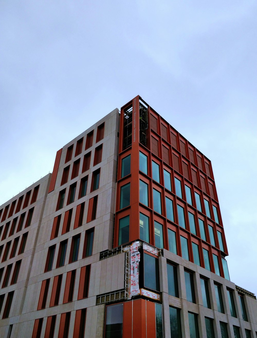 brown and white concrete building under blue sky during daytime