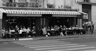 A stylish outdoor café bustling with people enjoying their day.