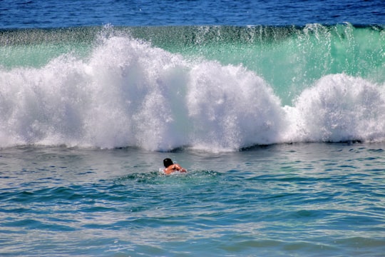 man surfing on sea waves during daytime in The Wedge United States
