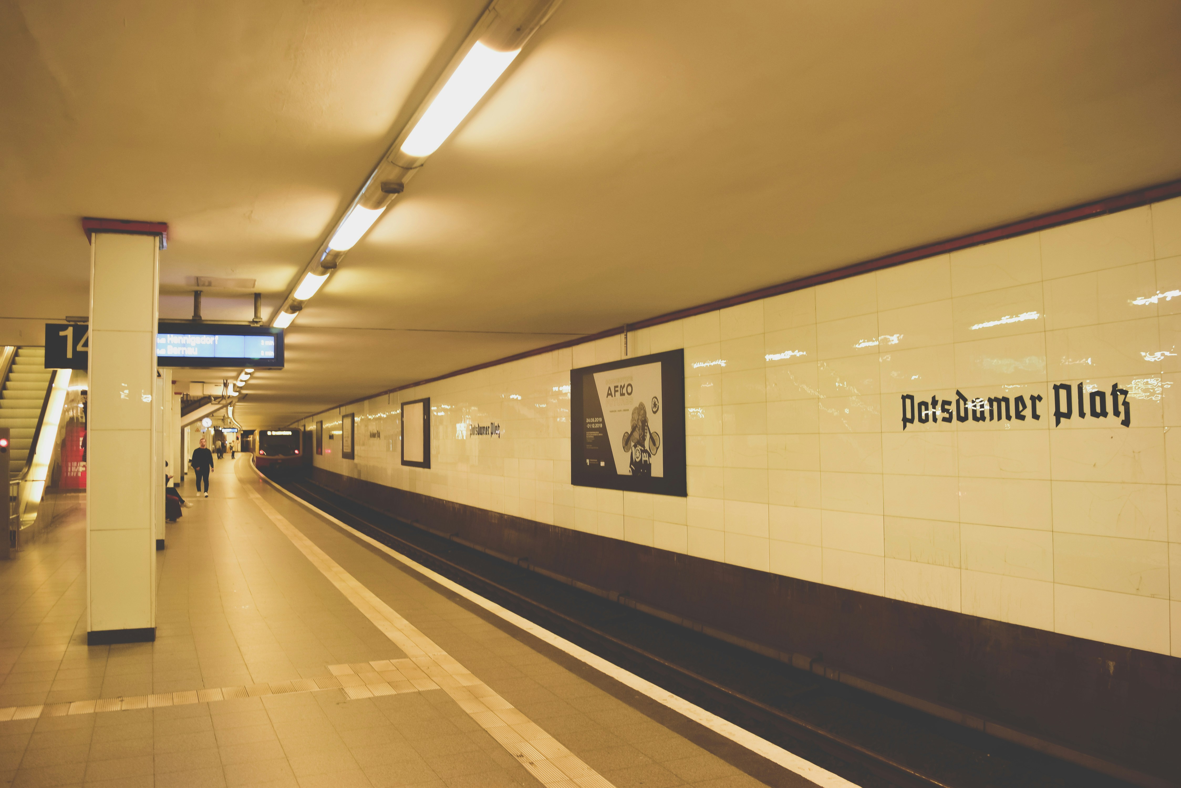 woman wearing yellow long-sleeved dress under white clouds and blue sky during daytime