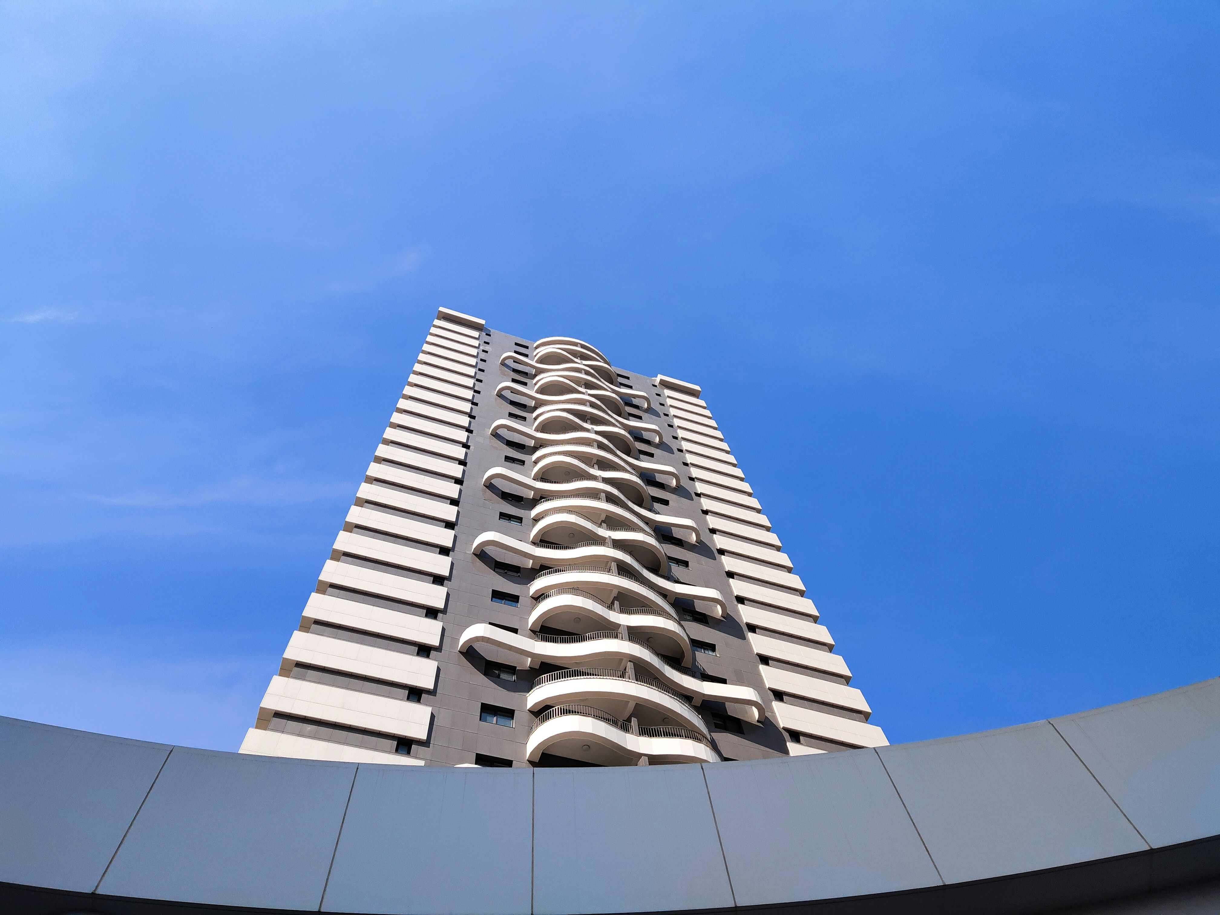 gray concrete building under blue sky during daytime