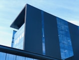 A modern commercial building with large glass windows.