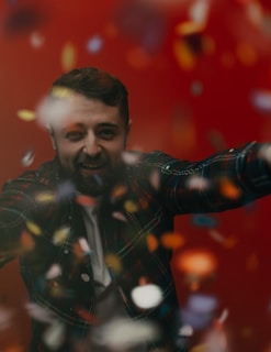 Smiling person with freshly colored beard, showcasing deep, natural tones.