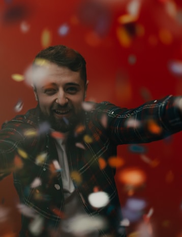 Smiling person with freshly colored beard, showcasing deep, natural tones.