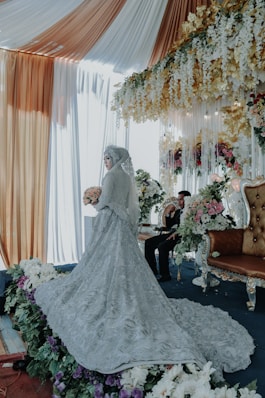 bride and groom sitting on brown wooden framed brown padded armchair