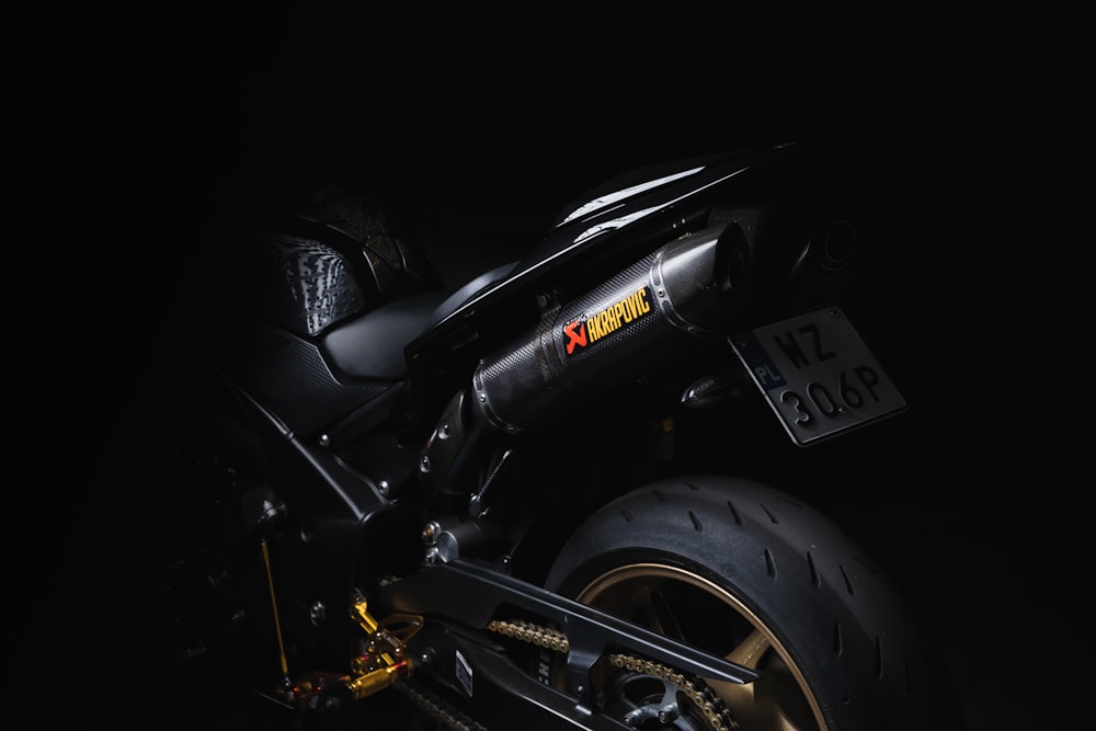 black and yellow motorcycle with black background