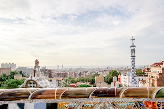 city buildings under white sky during daytime in Park Güell Spain