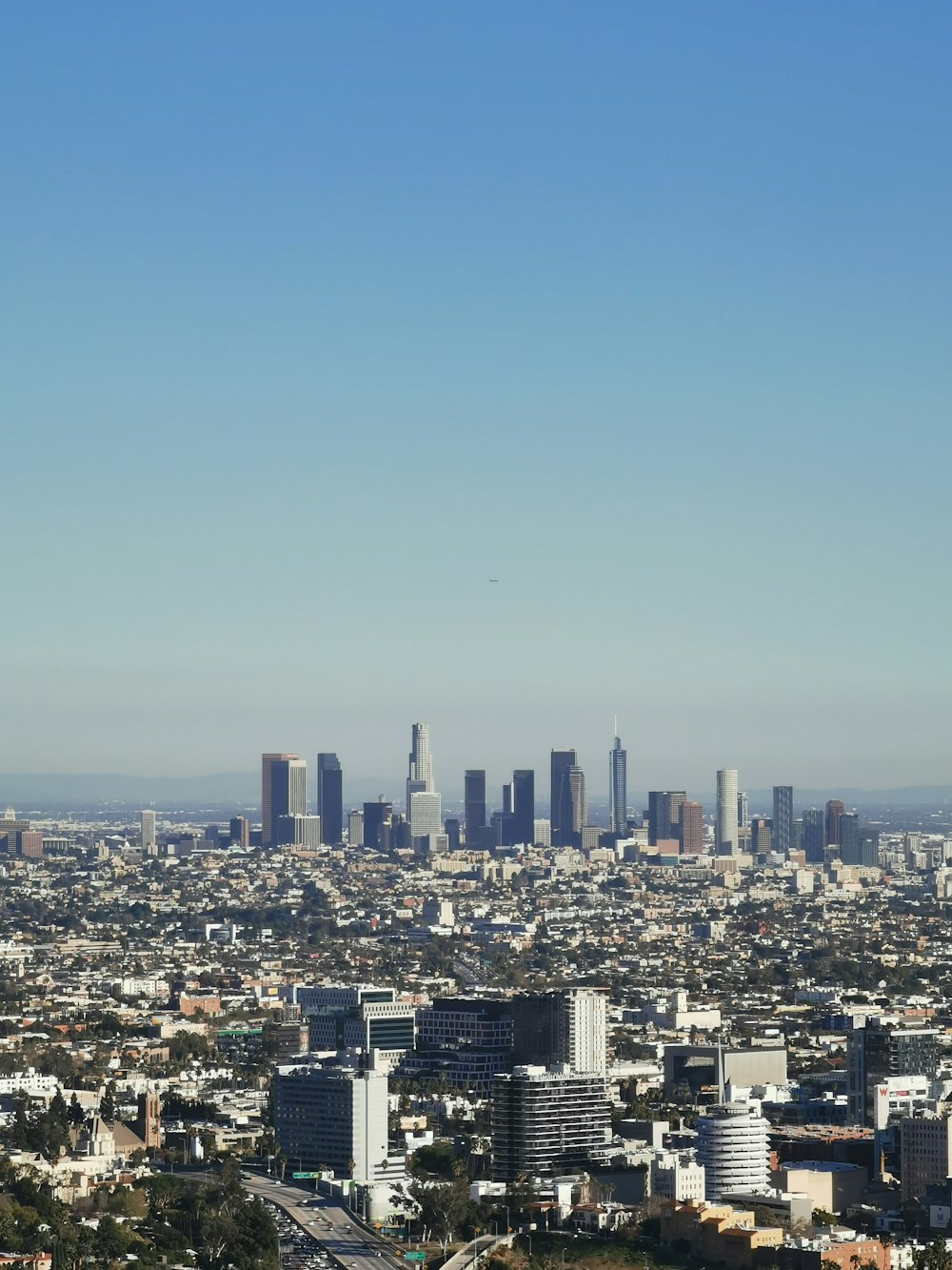 city skyline under blue sky during daytime