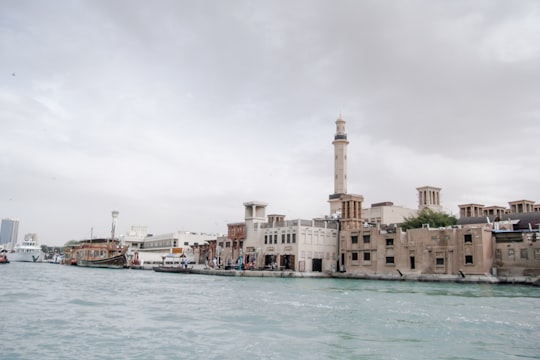 body of water near buildings during daytime in Dubai Creek United Arab Emirates