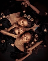 3 women lying on bed