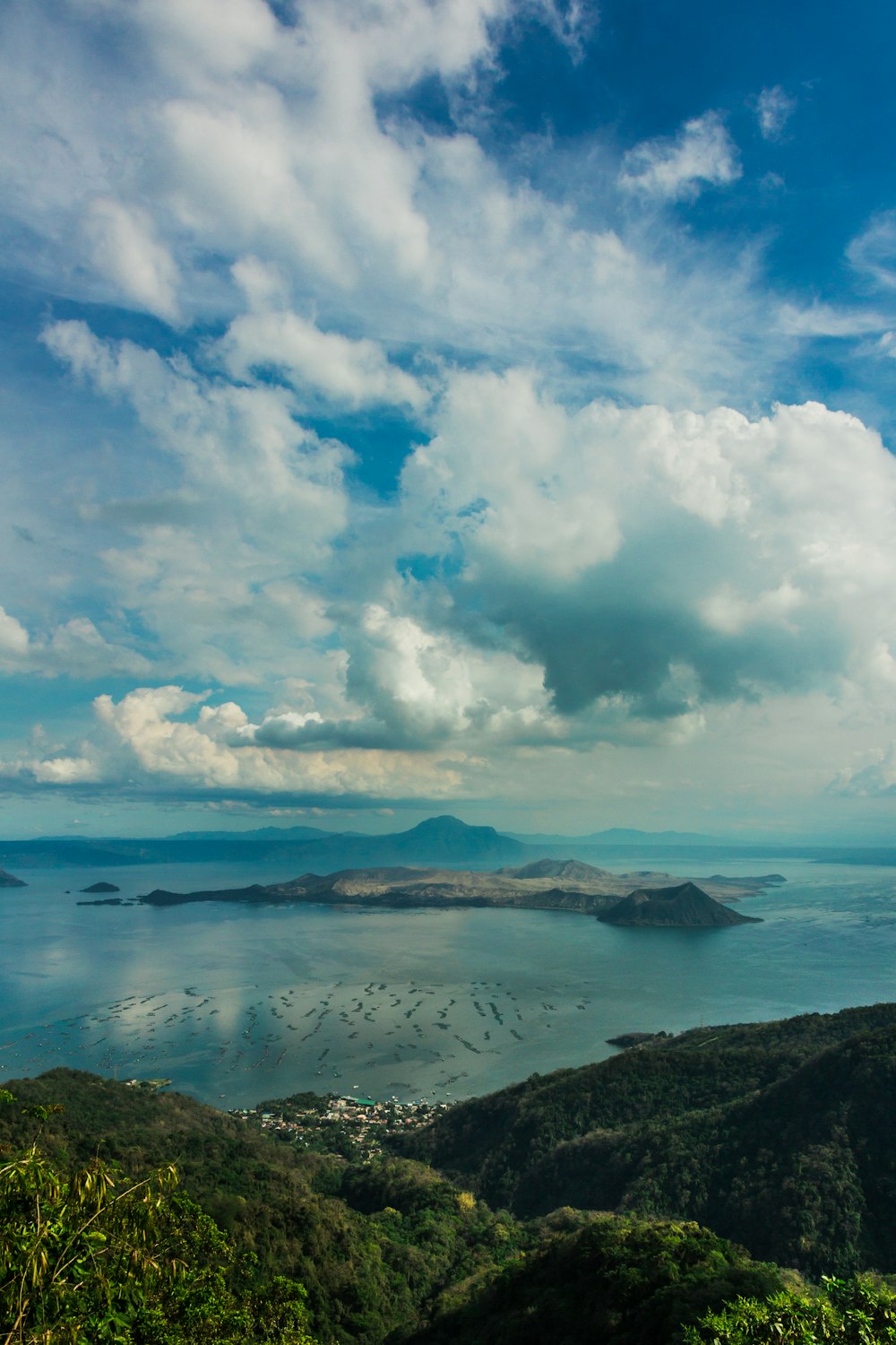 blue sky and white clouds over lake