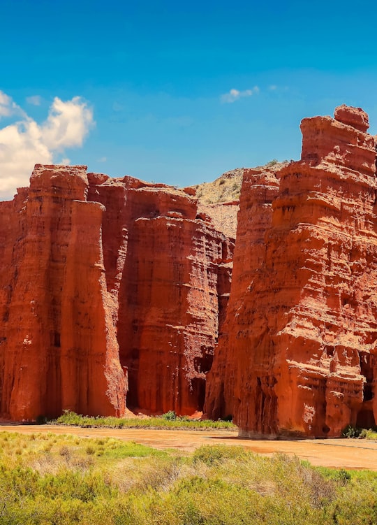 brown rock formation under blue sky during daytime in Salta Argentina