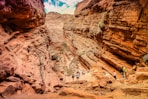people walking on rocky mountain during daytime