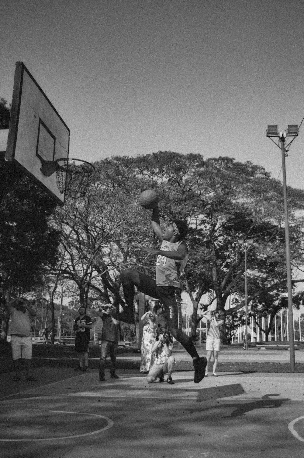 a man jumping up into the air to dunk a basketball