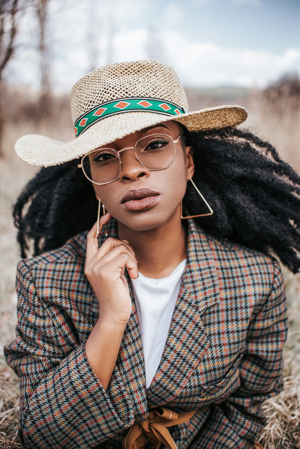 woman in brown and black hat and sunglasses