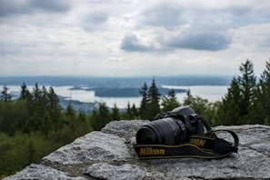 A Nikon camera in action capturing a beautiful landscape.