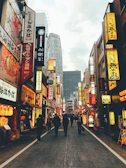 A bustling street scene in Tokyo with neon signs and busy pedestrians