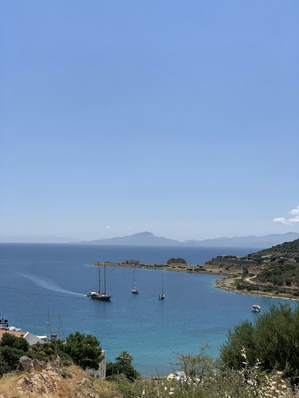 white boat on sea during daytime