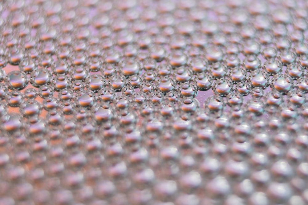 silver and blue beads on white textile