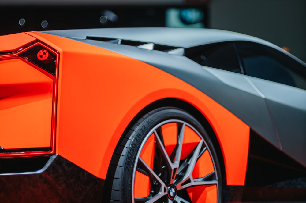 orange and black ferrari sports car