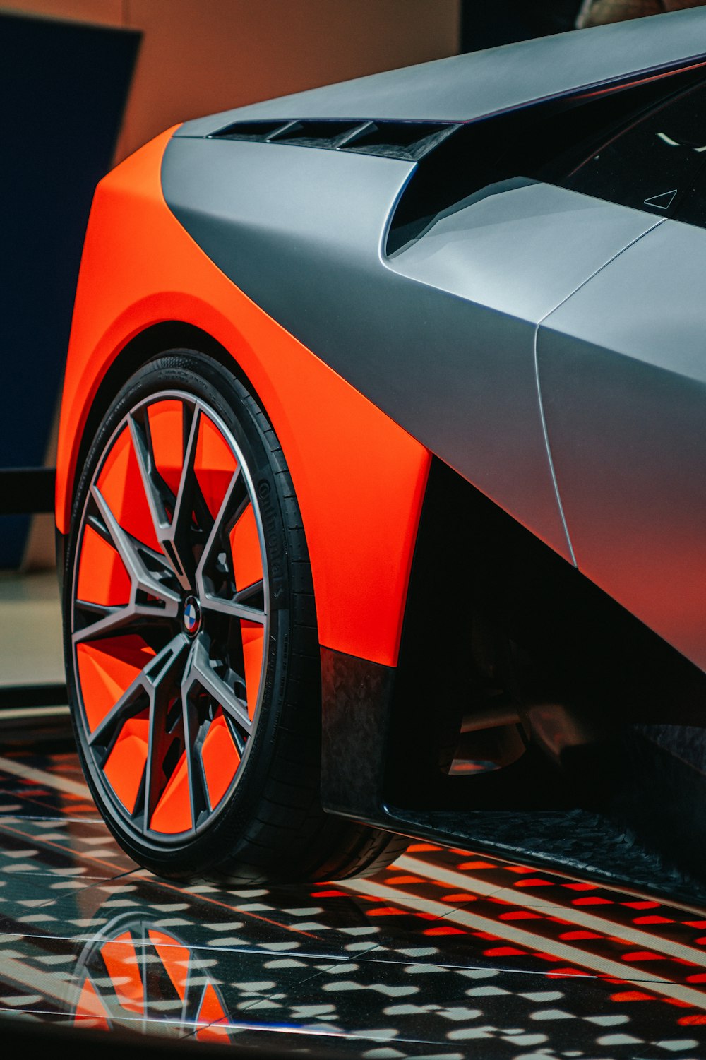 orange and black car on brown and black floor