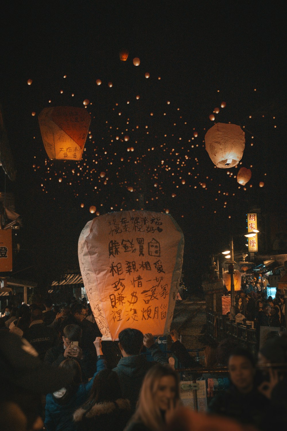 people walking on street during night time